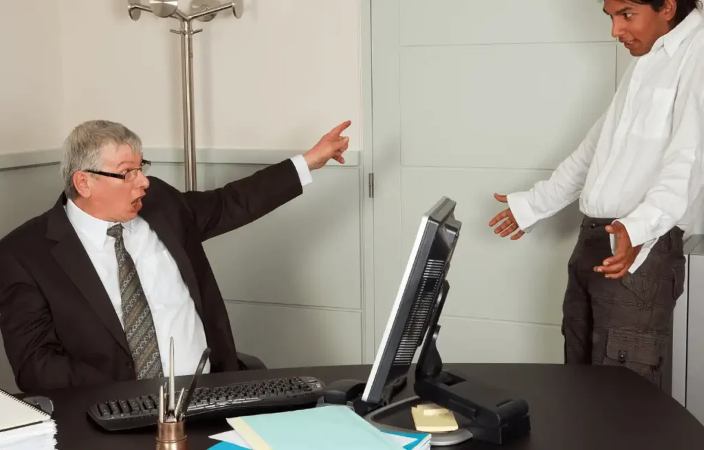 Image of boss firing an employee for reporting rest break violations.