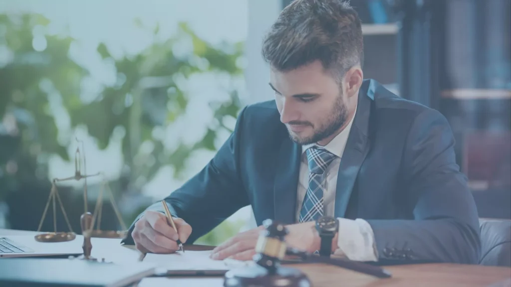 Lawyer writing a harassment claim, showing his best, undivided loyalty to this case.