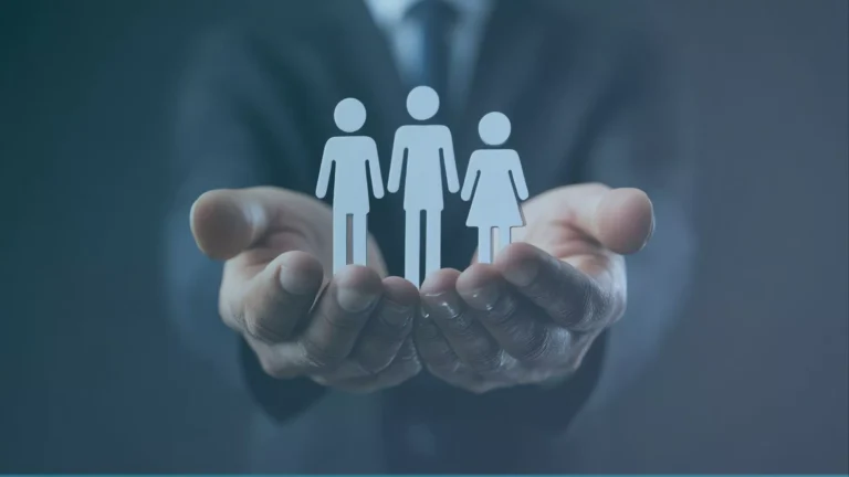 A lawyer holds paper cutouts representing clients who are wrongfully terminated misclassified contractors in Oregon.