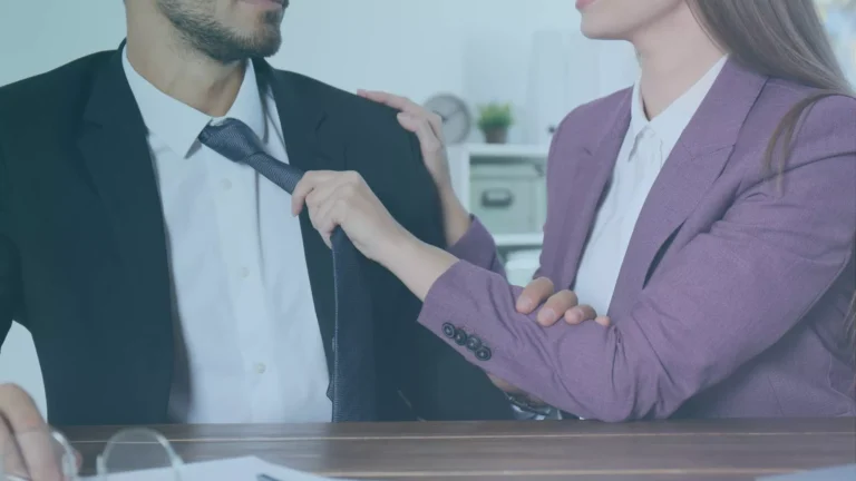 Close-up of workplace sexual advances involving unwanted physical contact, representing quid pro quo sexual harassment in Oregon.