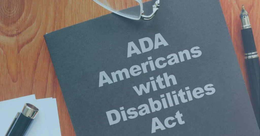 Document labeled Americans with Disabilities Act (ADA) on a desk, representing workplace disability rights and accommodations.