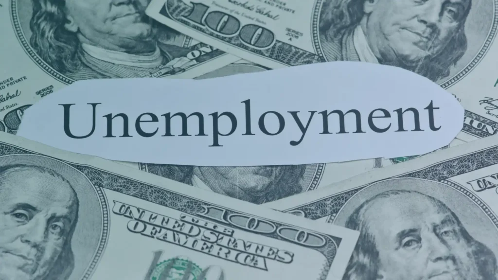 Unemployment notice displayed over money, representing unemployment benefits, appeals, and hearing representation for Oregon workers.