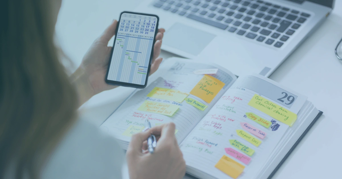 Employee reviewing a work calendar, schedule, and time records that may help document unpaid overtime hours.